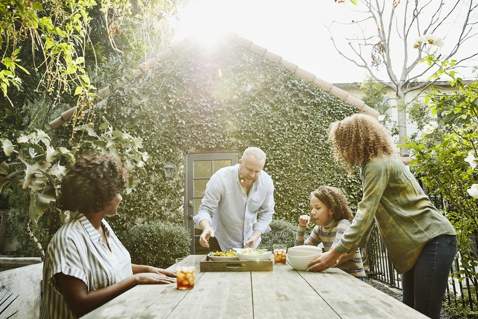 Outdoor family gathering with food and drinks