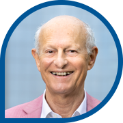 Elderly man in pink blazer outdoors