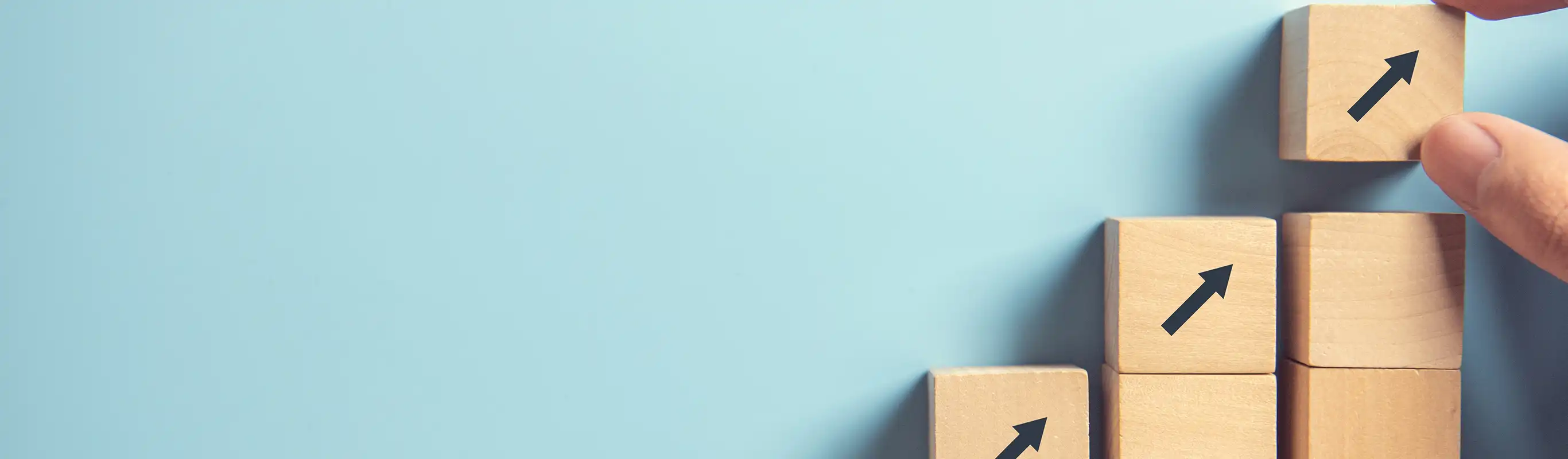 Wooden blocks with upward arrows