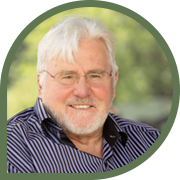Elderly man outdoors in striped shirt