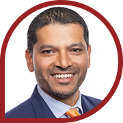 Professional man in suit with orange tie