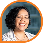 Professional woman in striped blazer indoors