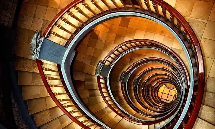 Spiral staircase with wooden railings