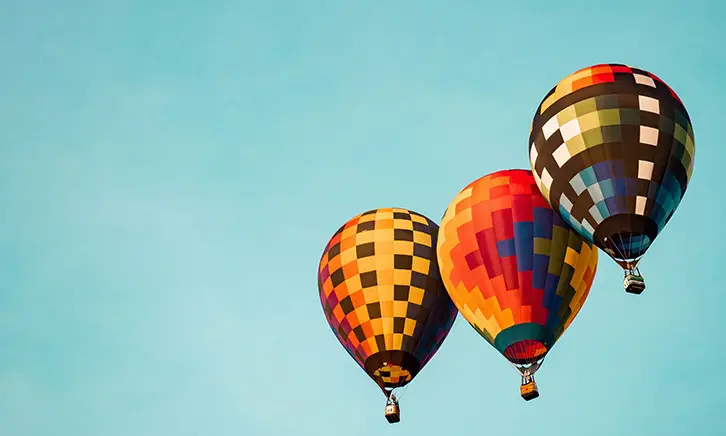 Colorful hot air balloons in clear sky