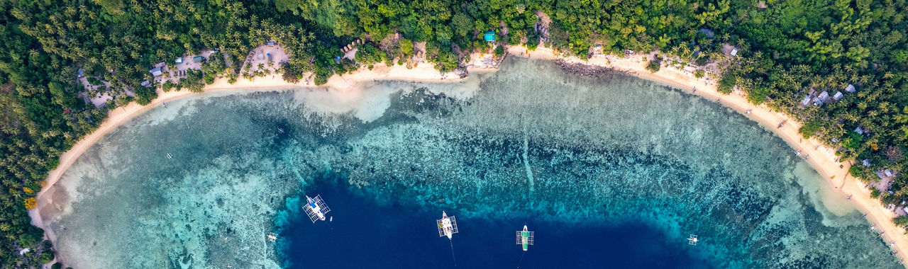 Aerial view of tropical coastline and boats